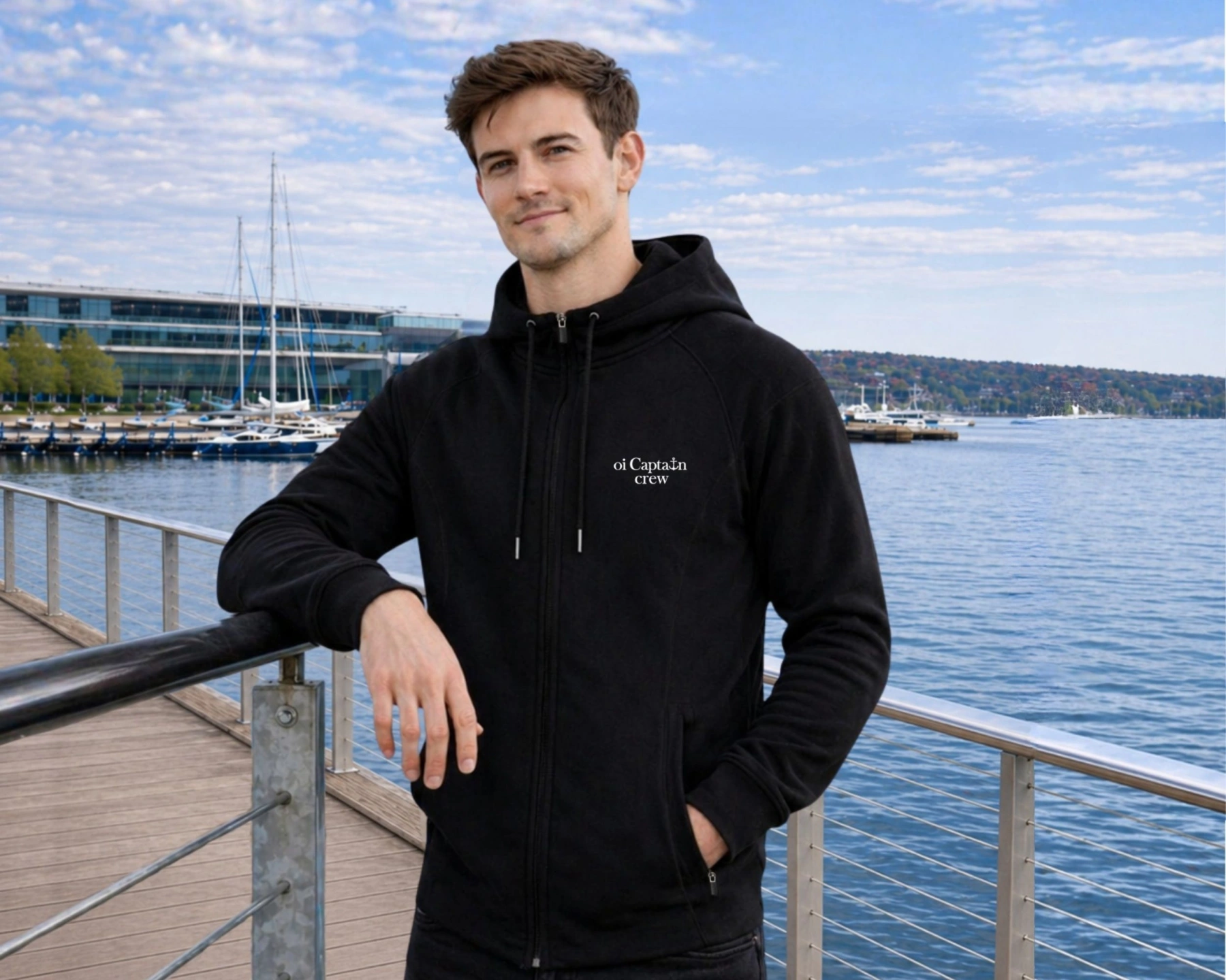 oi captain male model wearing le grand hoodie full zip black front boating coastal lifestyle.jpg
