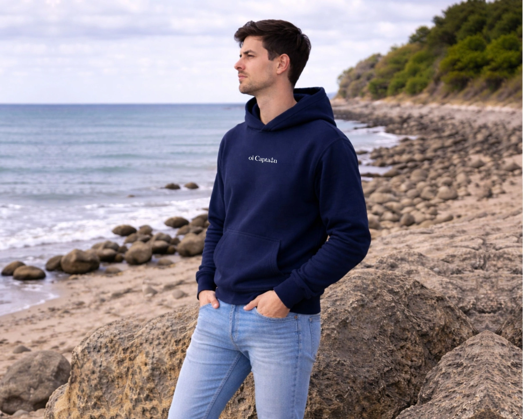 male-model-wearing-oi-captain-seas-the-day-hooded-sweatshirt-navy-front-view-coastal-vibes.jpg