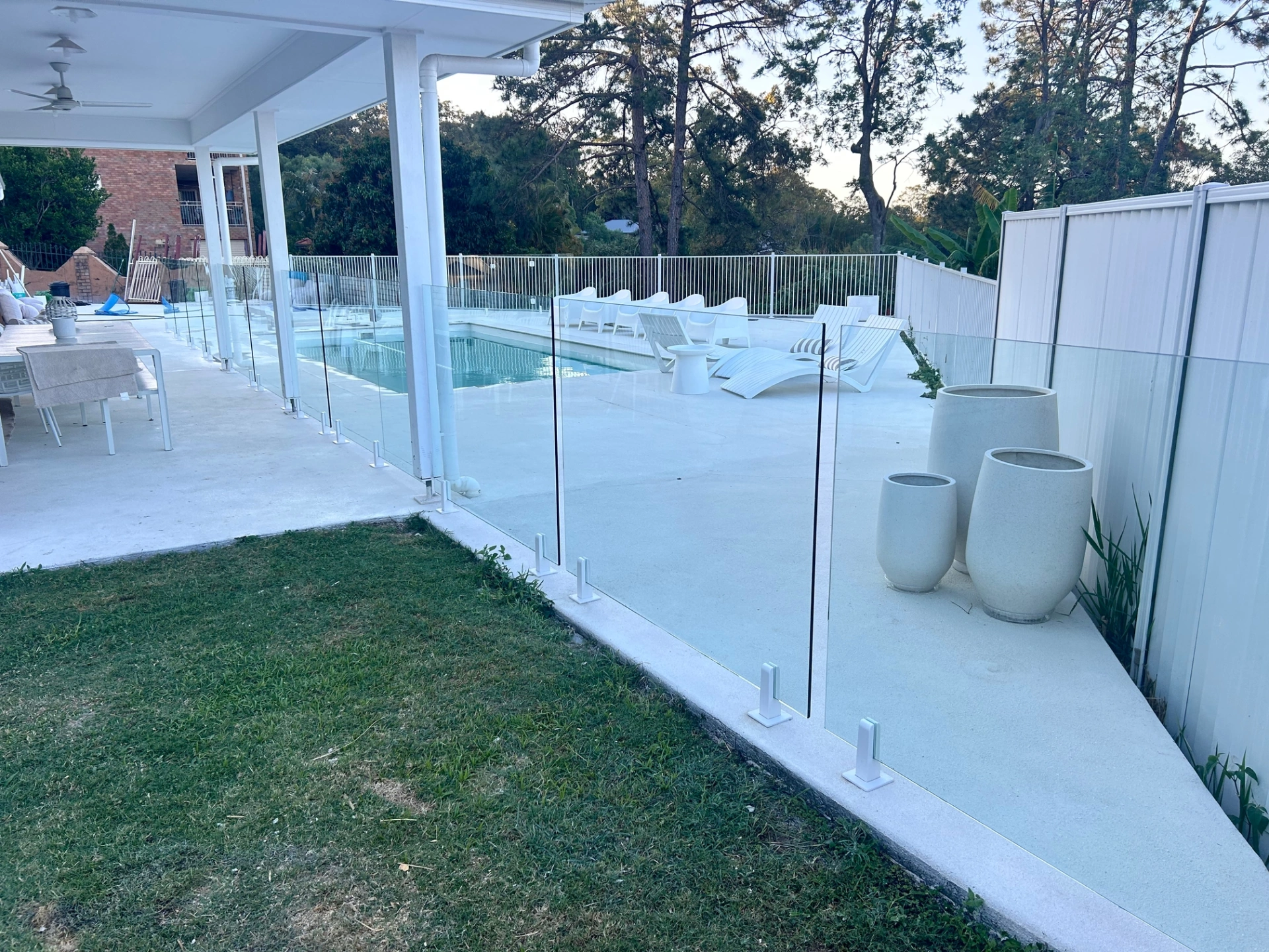 Frameless Glass Pool Fencing White Spigots.JPG