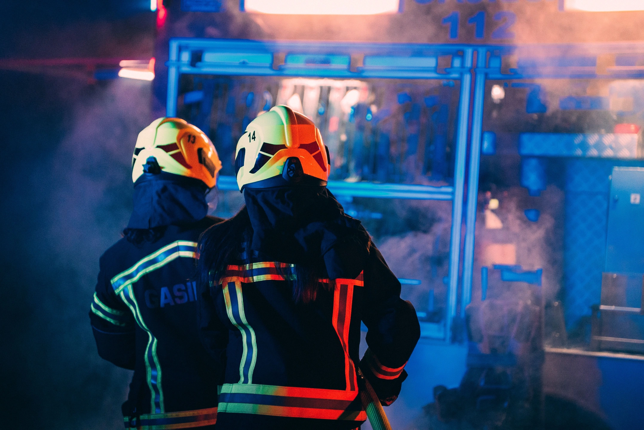 rear-view-of-two-firefighters-responding-to-an-eme-2026-01-08-00-22-07-utc.jpg