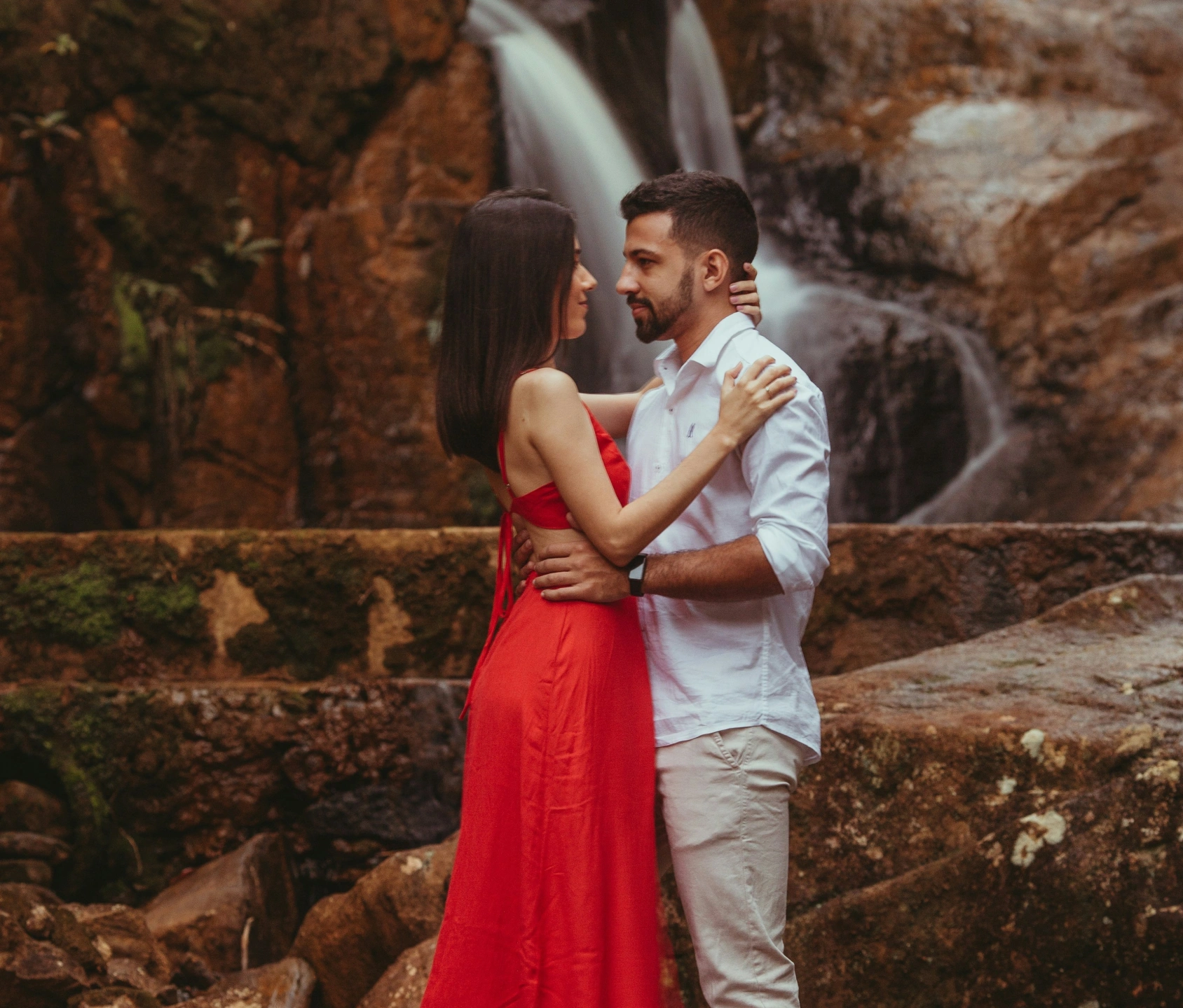 attractive-couple-in-front-of-a-waterfall.jpg
