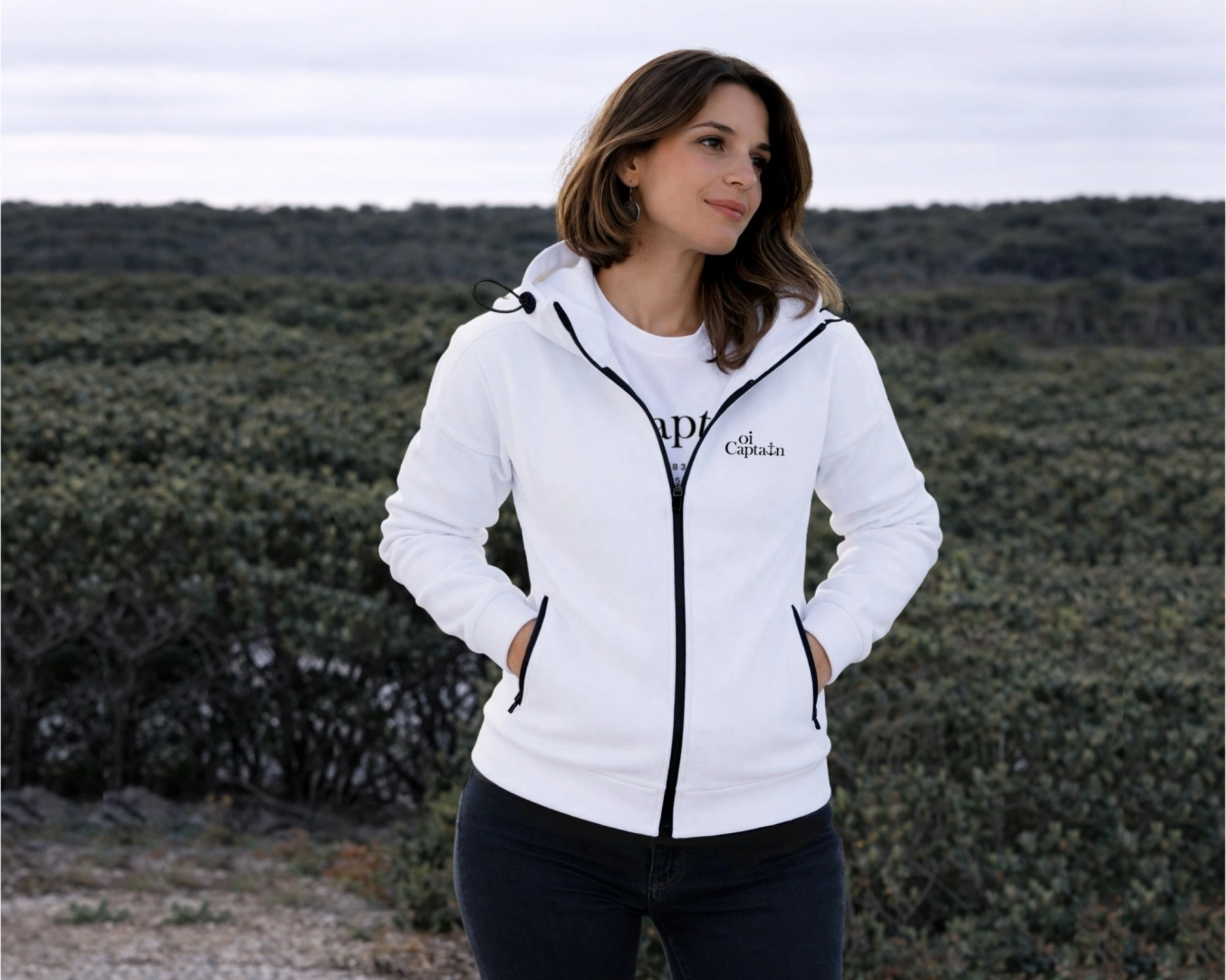female model wearing oi captain seascape hoodie full zip white fully zipped front view weekend vibes.jpg