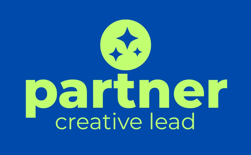 Open mouth cut-out with a green geometric glyph on a blue background, 2t Creative packages banner