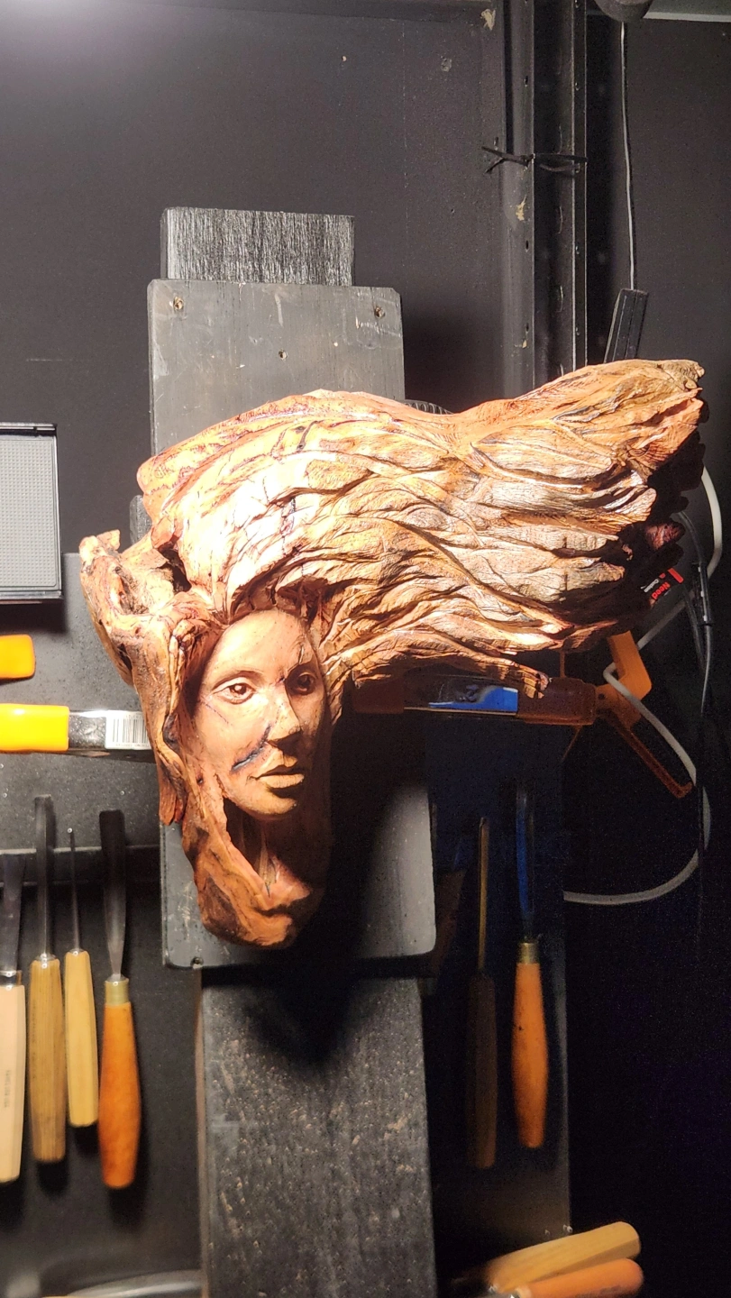 Wood carved lady with hair.jpg