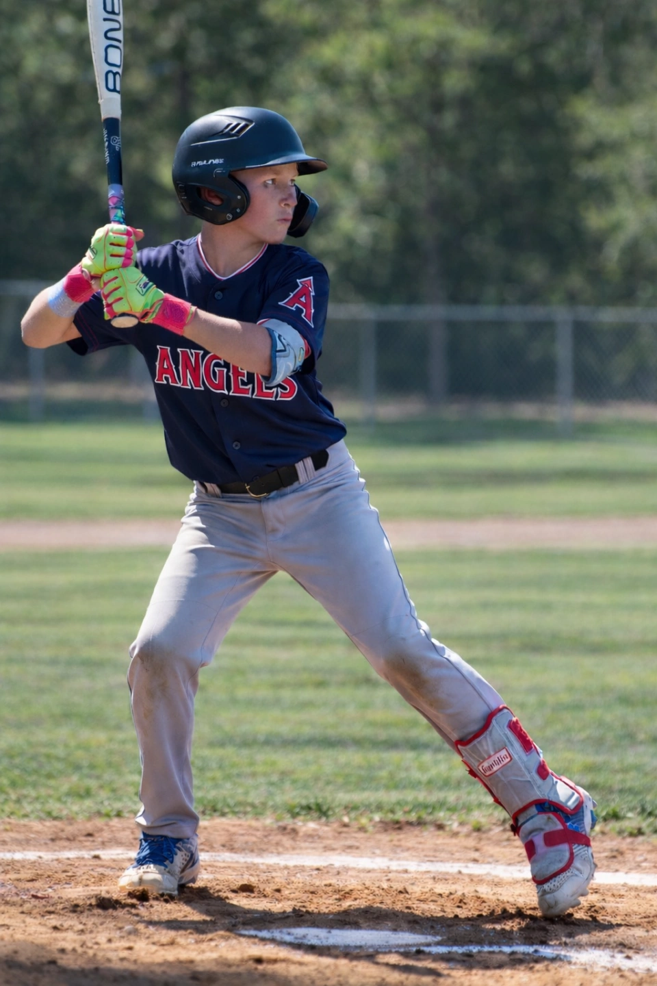 Young baseball player in batter's box.png