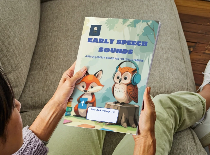 Workbook 1 front cover in hands on couch.png