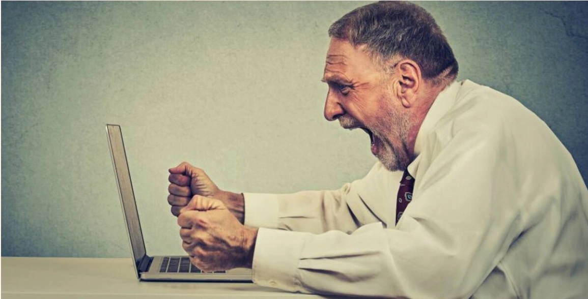 Man furious with computer.jpg