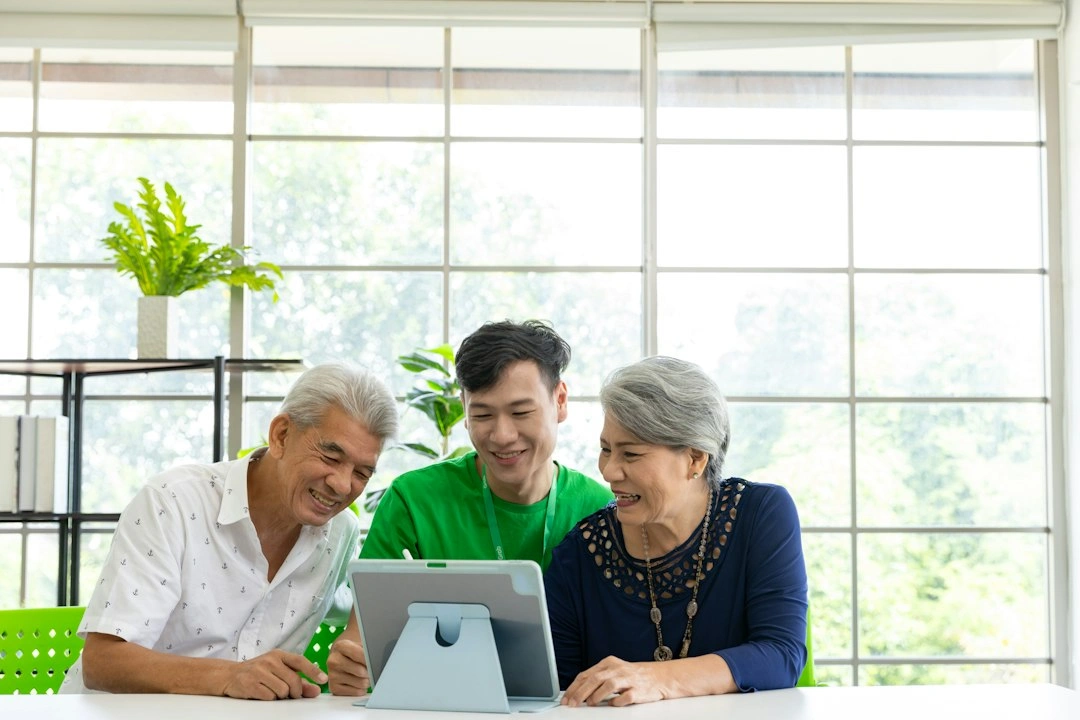 Care coordinator helping an older couple organise their care