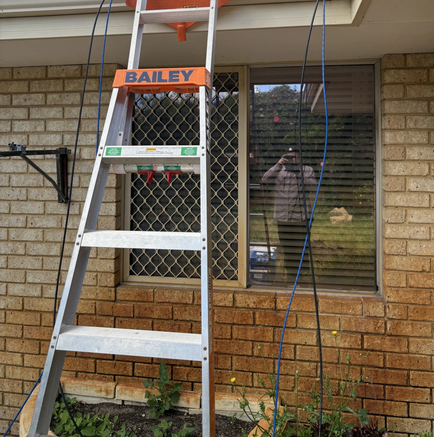 ladder gutter data cabling hanging over edge.jpg