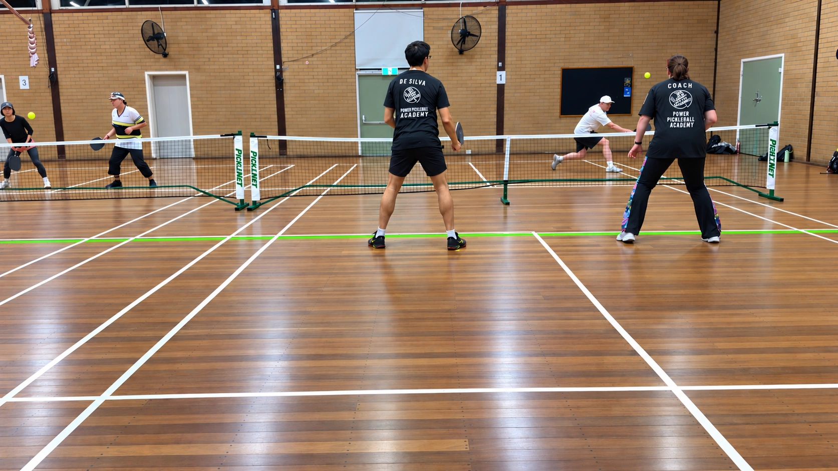 Indoor Pickleball Rally in the Gym.png