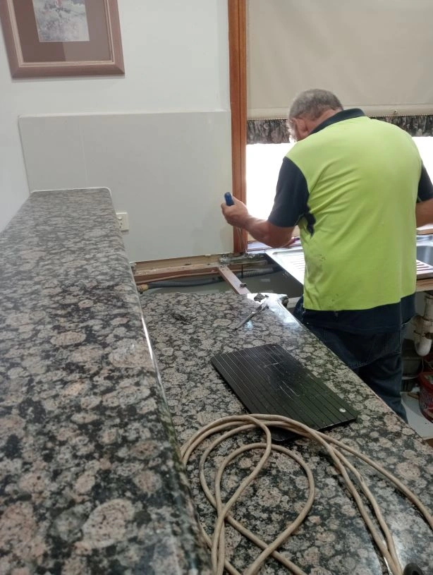 demolishing granite top.jpg
