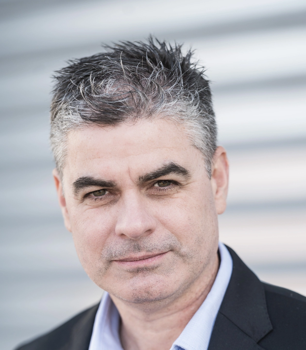 Chris Gibson_Headshot Standing Crop_2022-12-06.jpg