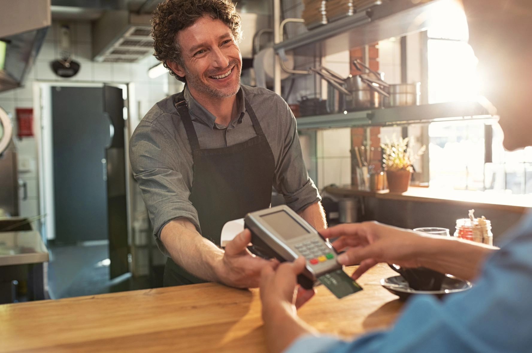 smiling man food credit card shutterstock_1186901998.jpg