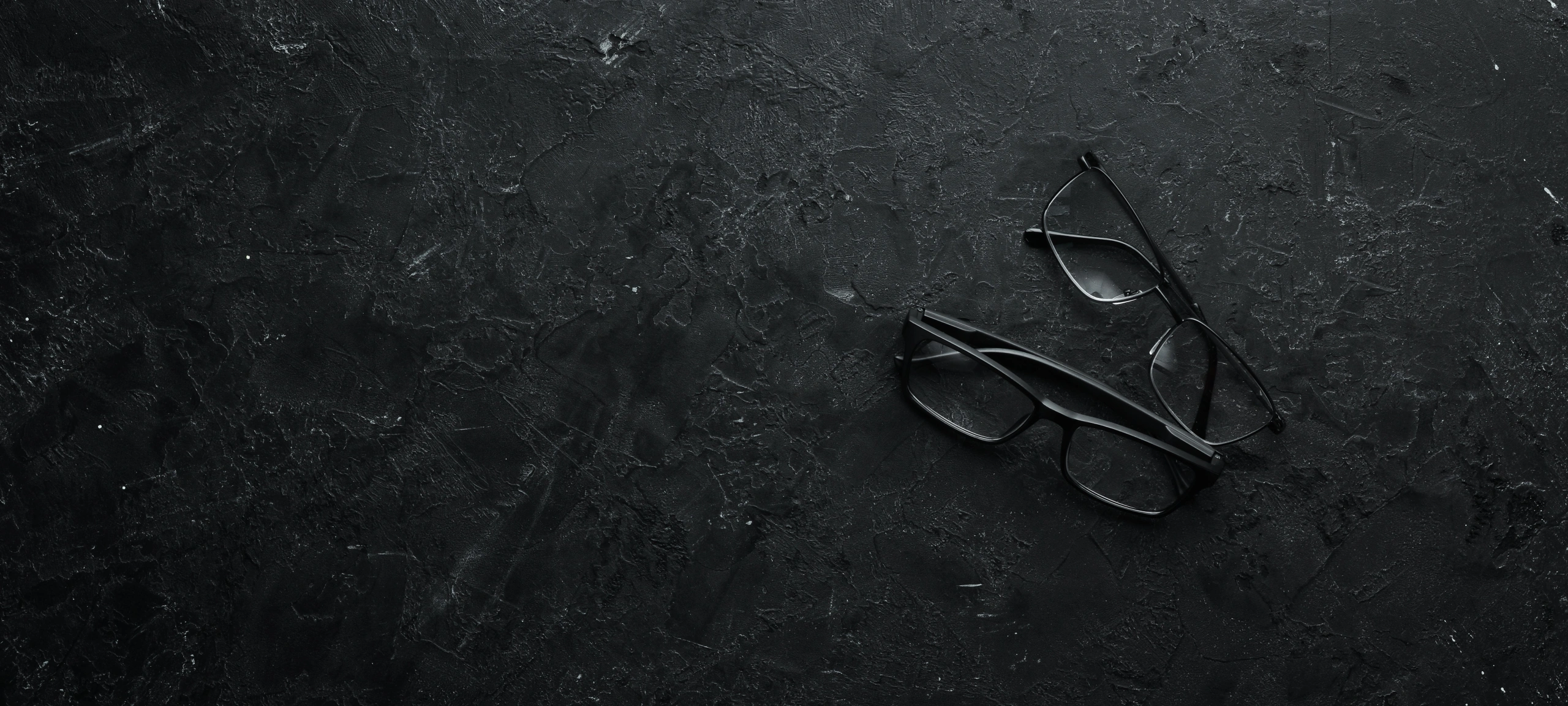 sight-glasses-black-stone-table-top-view-free-space-your-text (1).jpg