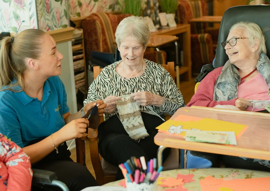 Carer spending time with older women during respite care