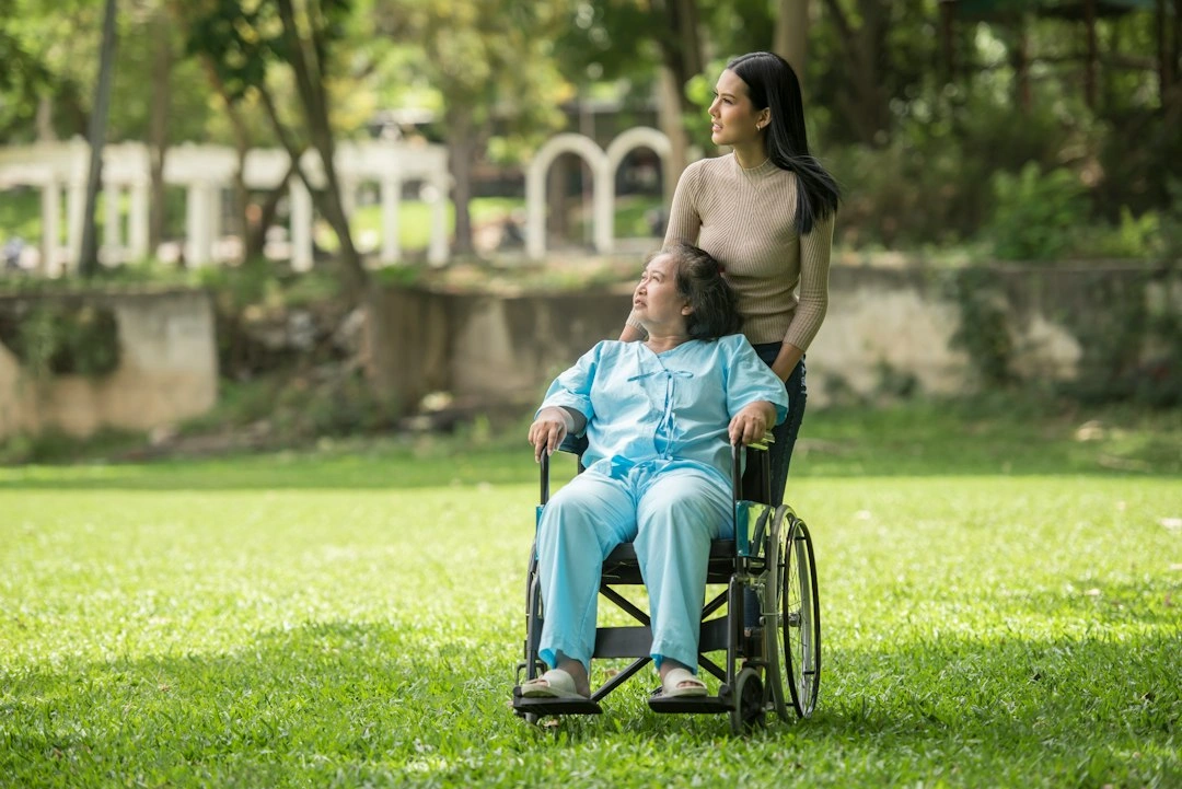 Support worker with participant in a park