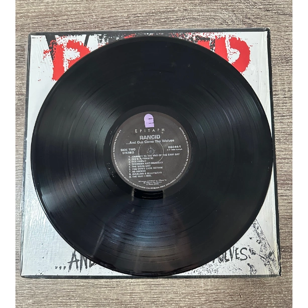 4-Rancid-And-Out-Comes-the-Wolves-record.png