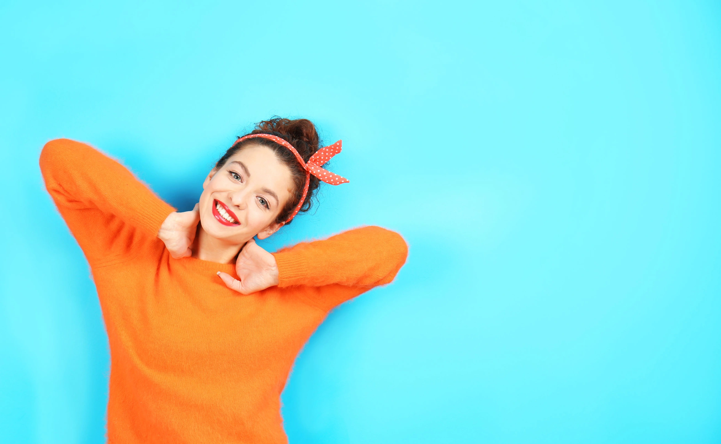 Girl orange jumper blue BG.jpg