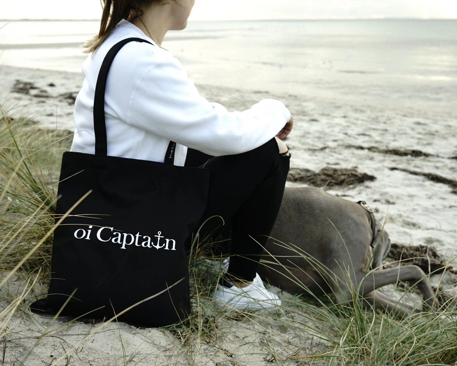 female model featuring oi captain vagabond tote bag black coastal lifestyle.jpg