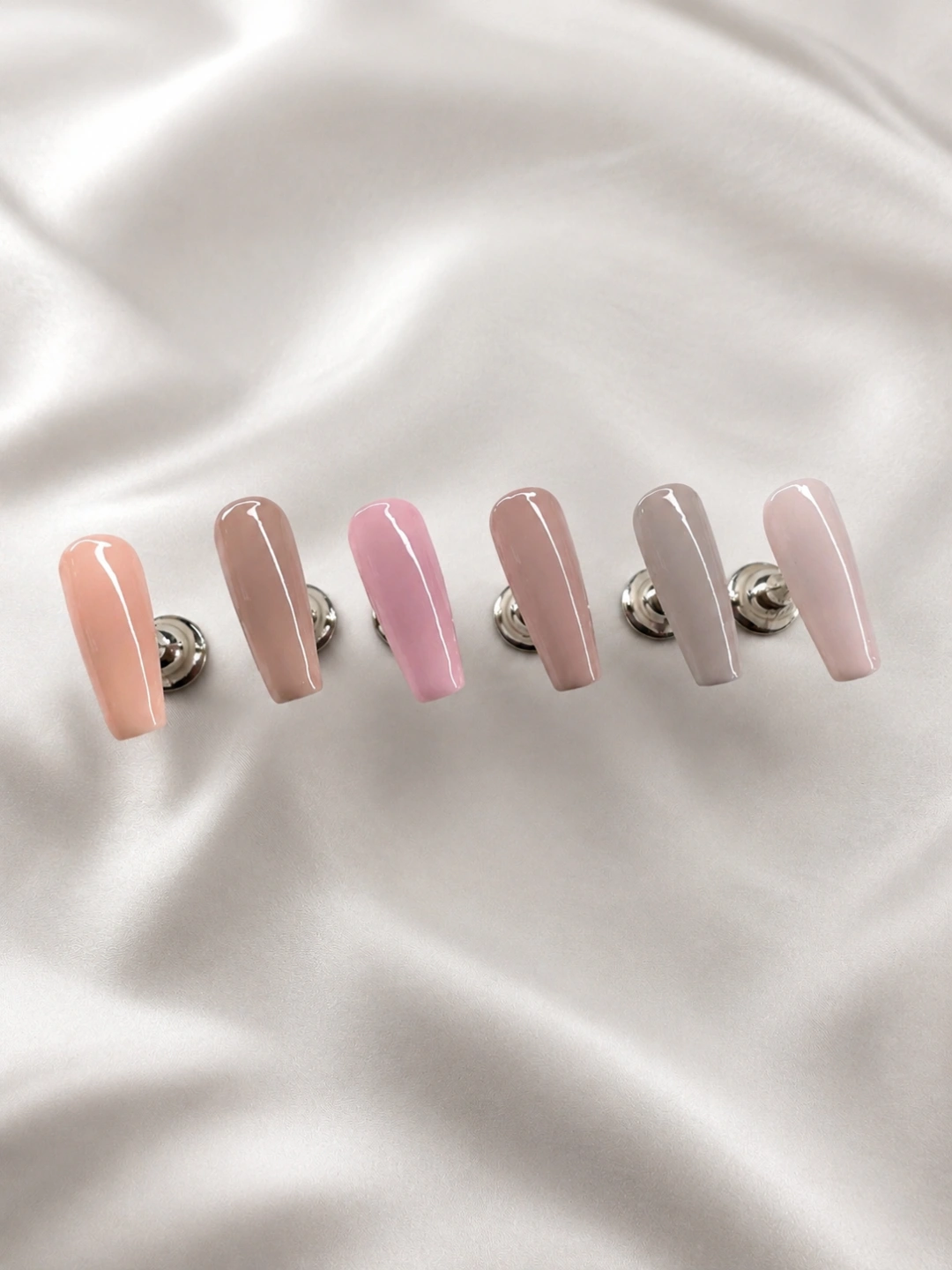 Neutral and blush gel colour palette on satin