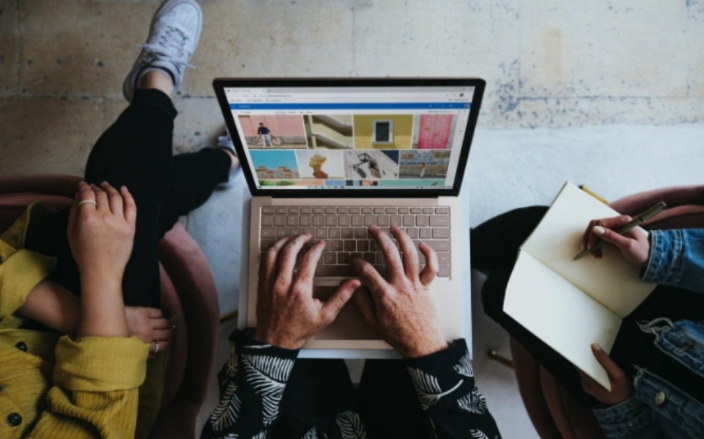 Typing on a laptop