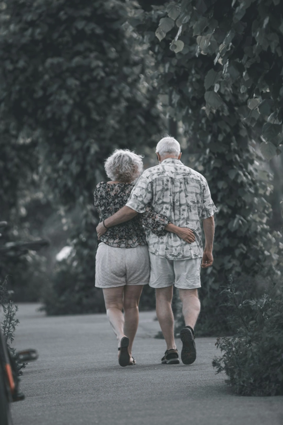 Older couple walking together outdoors
