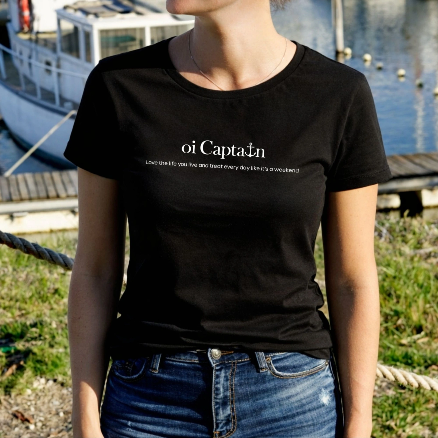 oi captain female model wearing queen of hearts t shirt black front coastal lifestyle.jpg