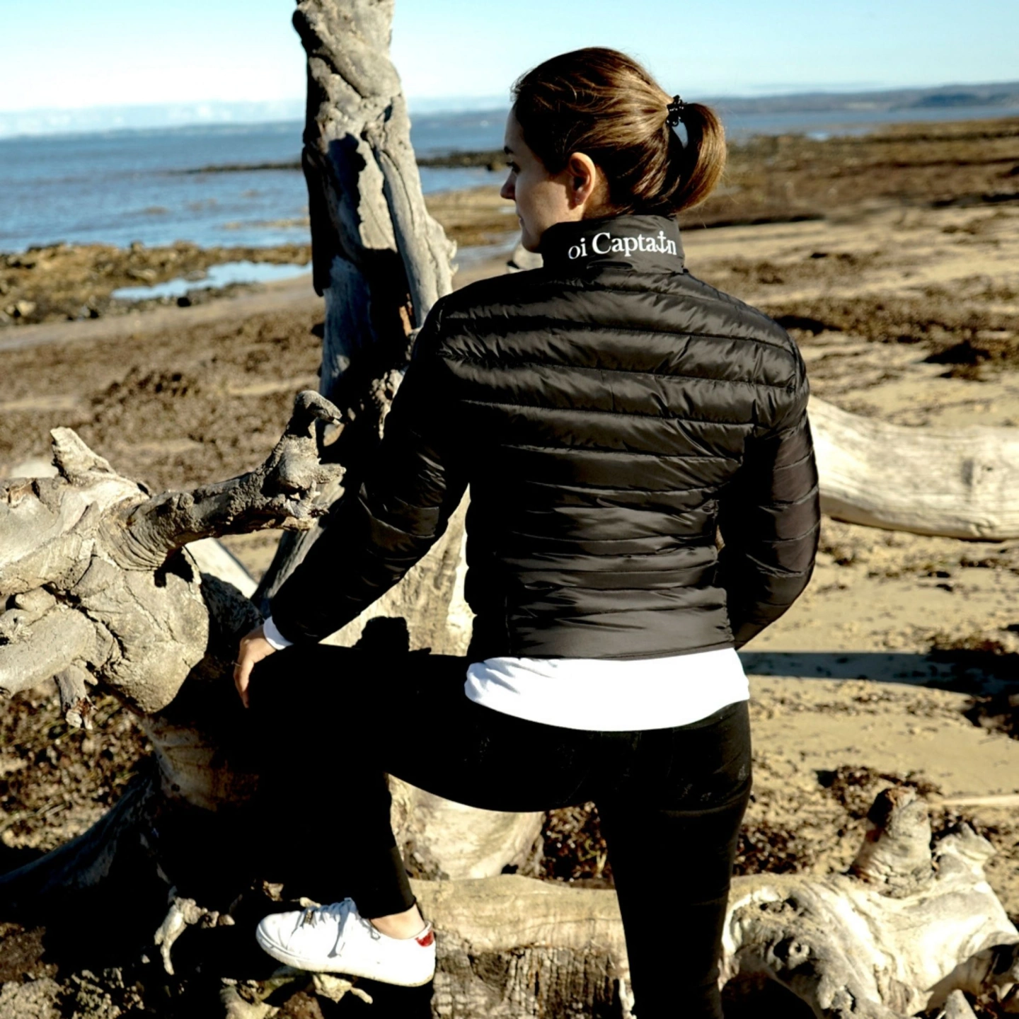 oi captain venus puffer jacket black back view outdoors.jpg