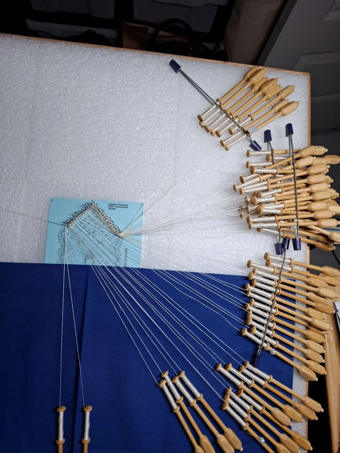 Lace_on_pillow_bobbins.jpg