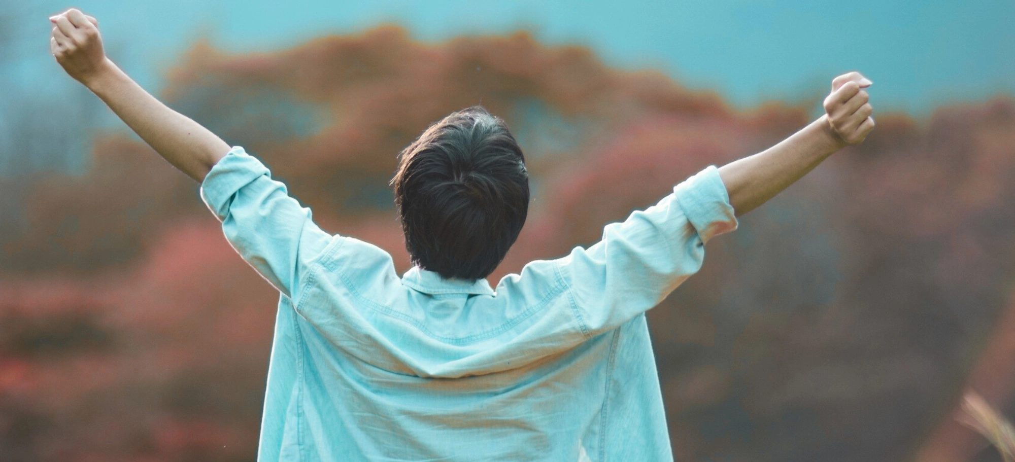 Person with arms stretched - hope symbolism cropped.png