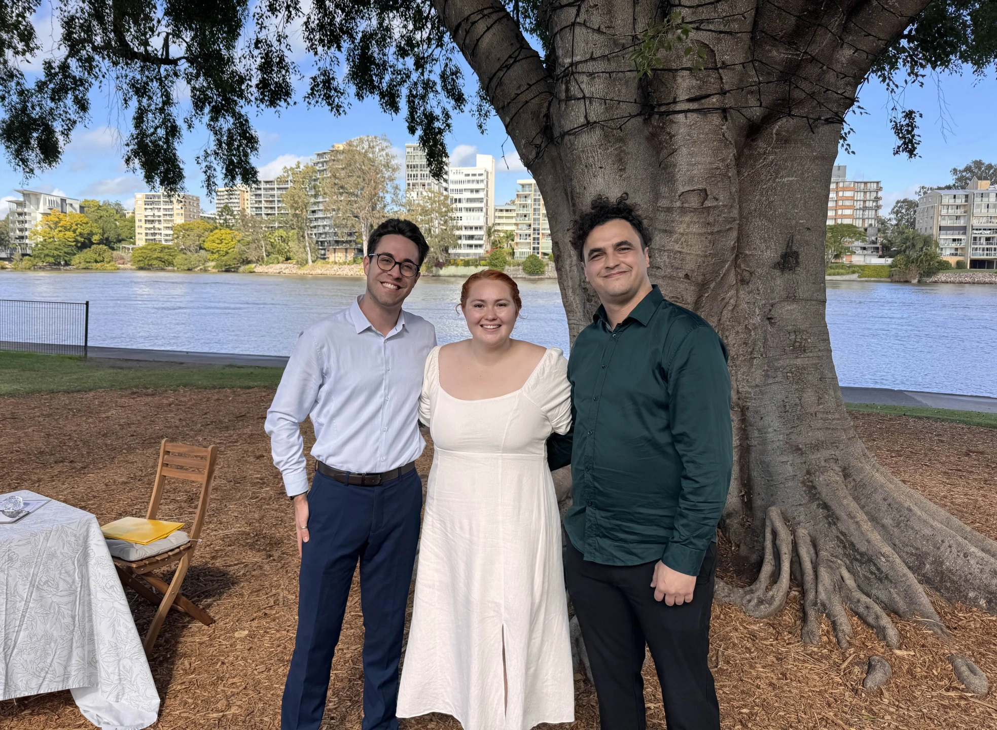 young_couple_and_celebrant_with_nature_in_background.jpeg