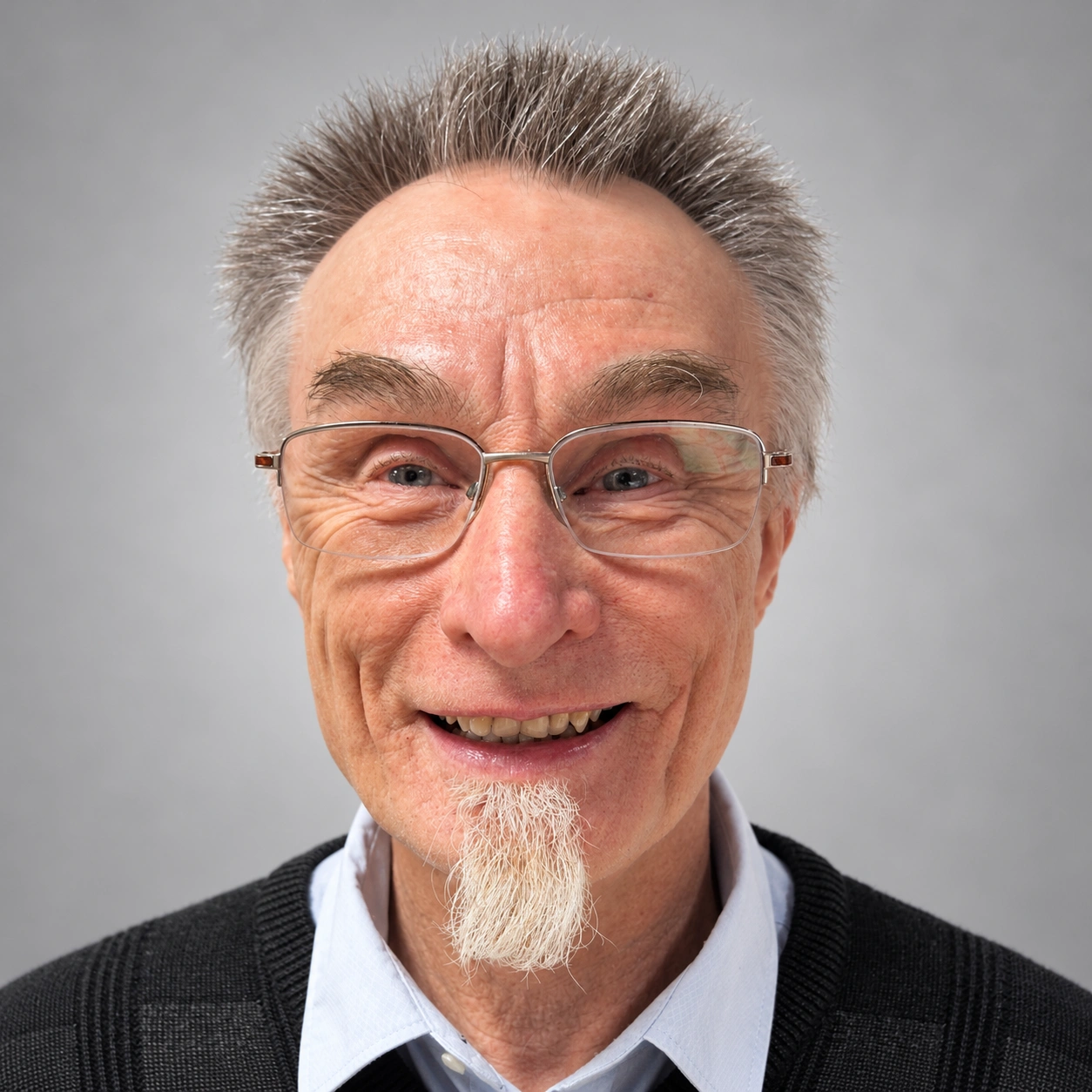 Warm Smiling Elderly Professional Headshot.png