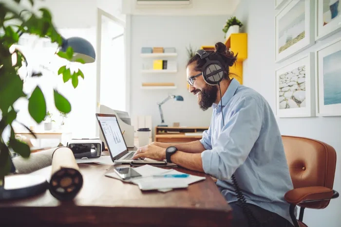 man-using-laptop-in-home-office.webp