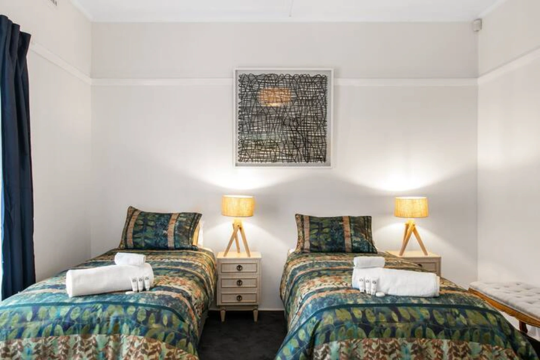 Cottage Main Bedroom 2 bed Setup.png