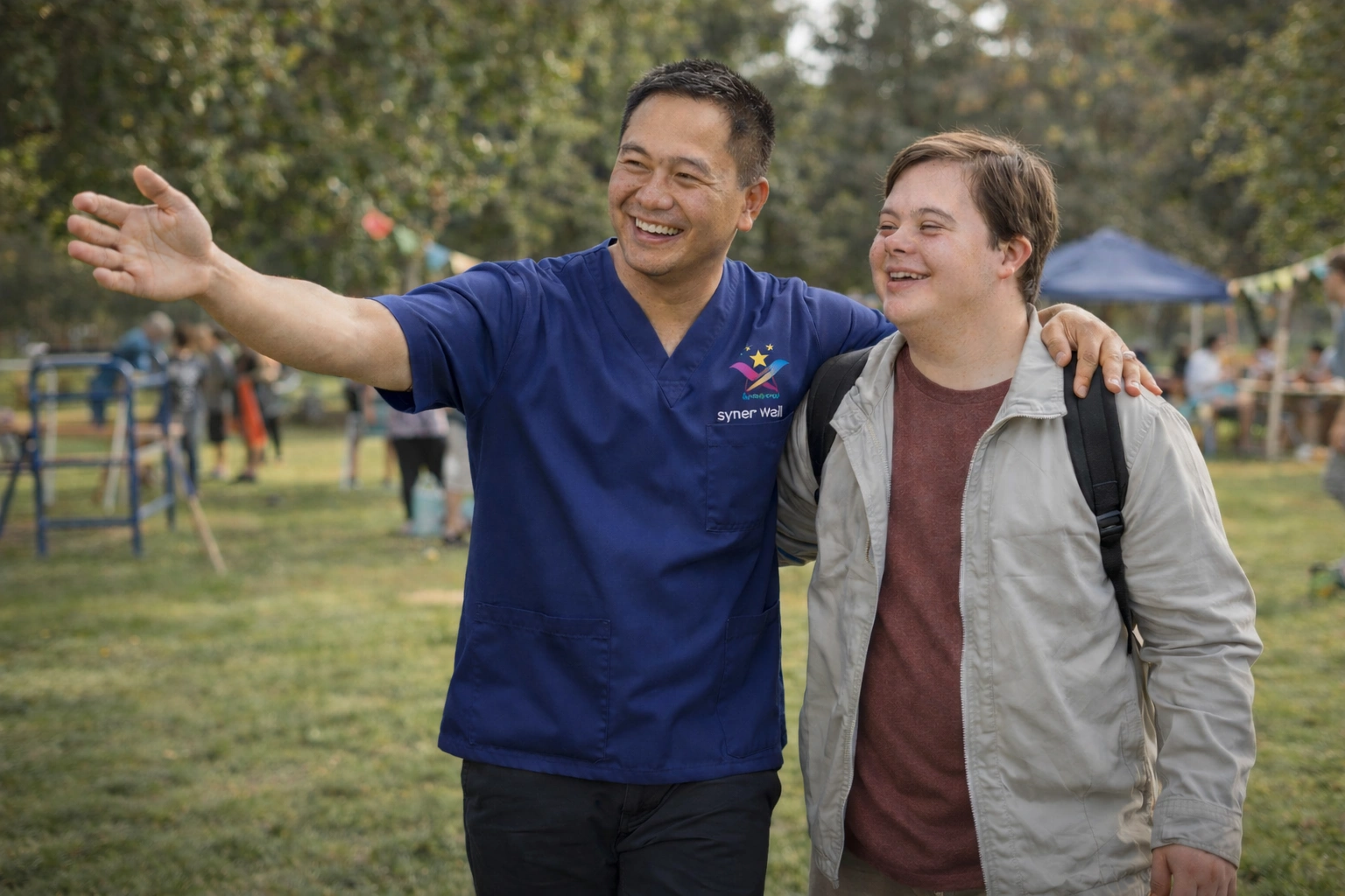 Support worker and young man outdoors.png