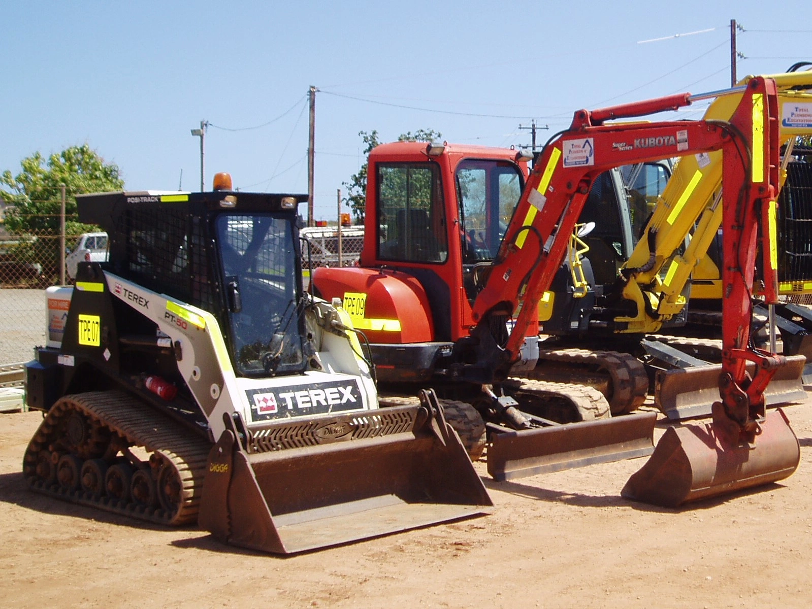 Excavators-and-Bobcat-in-a-line.JPG