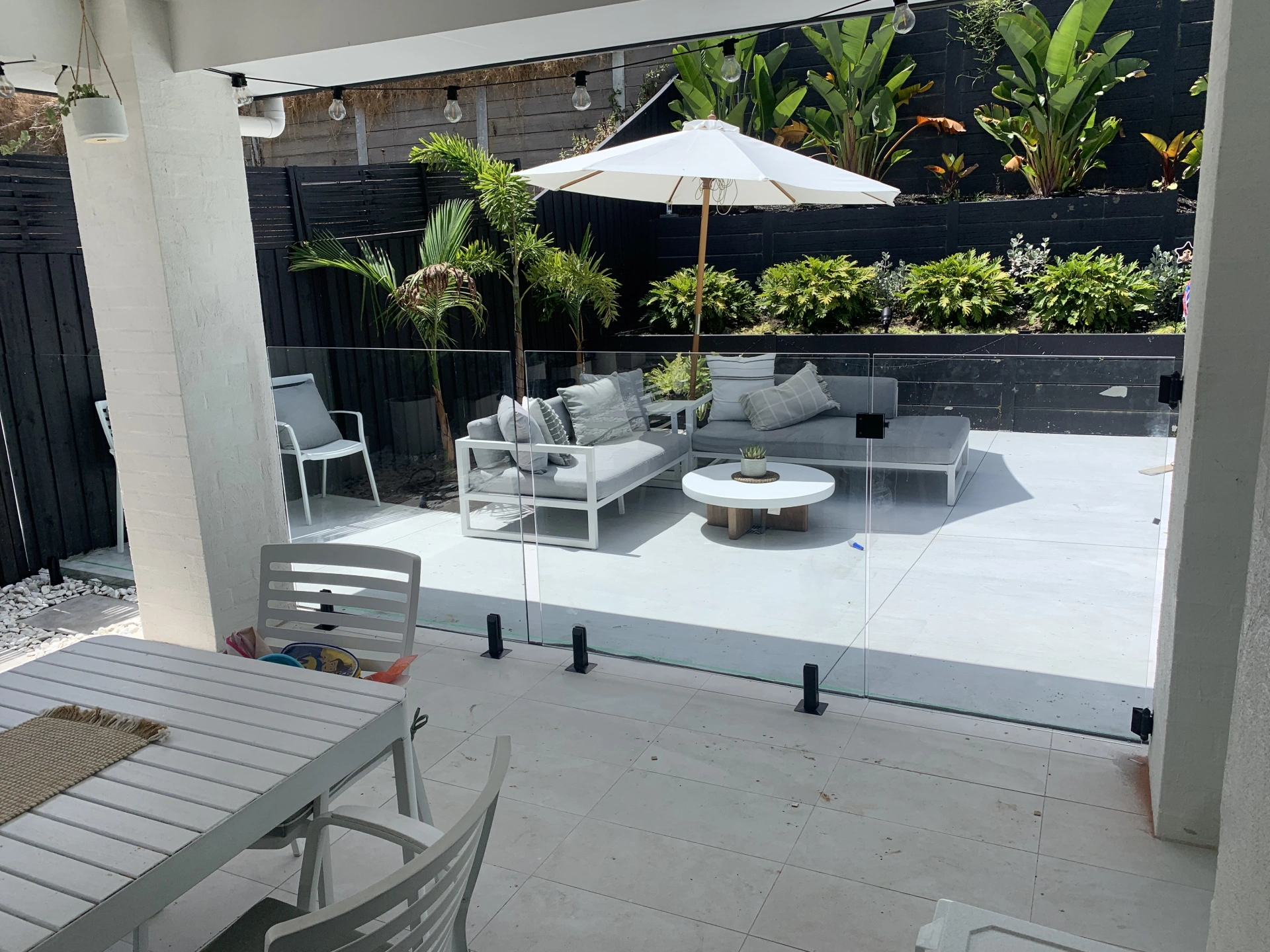 Frameless Glass Pool Fencing Black Spigots 2.JPG