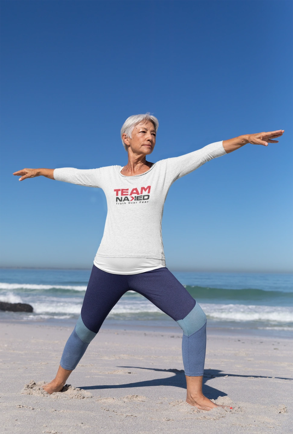 long-sleeve-tee-mockup-of-a-senior-woman-doing-yoga-by-the-beach-41565-r-el2.png