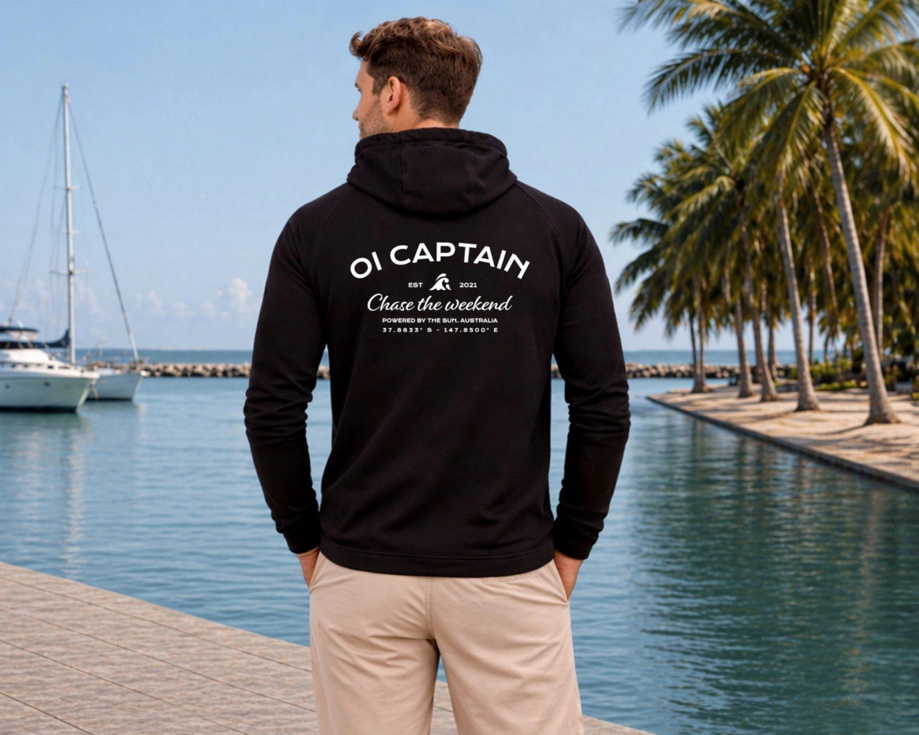 male model wearing oi captain escape long sleeve tshirt black back coastal lifestyle.jpg