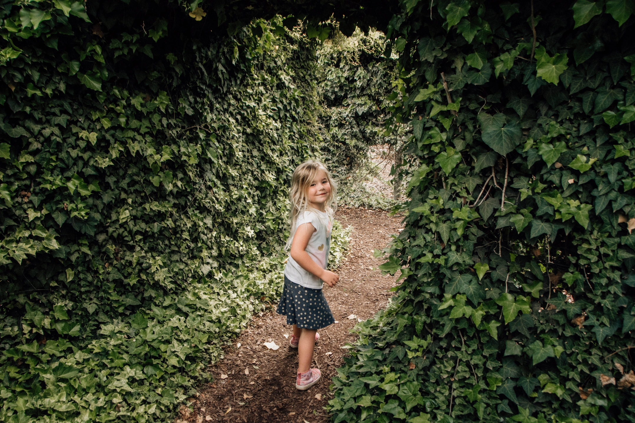 girl in ivy arch.jpg