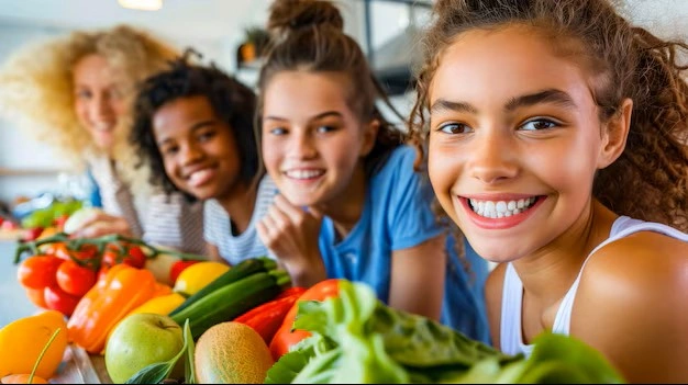 young girls with fruit and vegetables.jpg