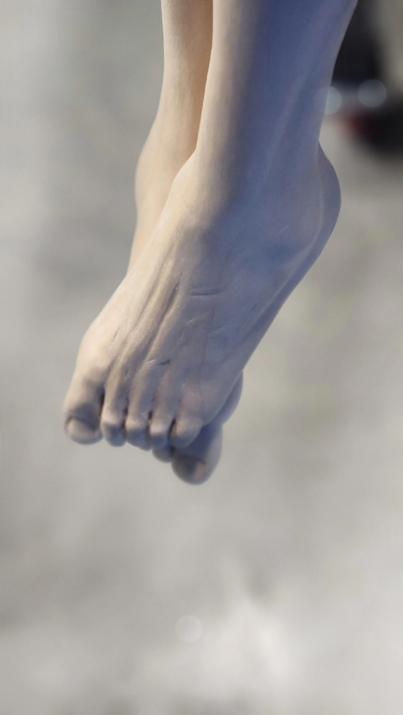 Wood carving Jesus feet.jpg